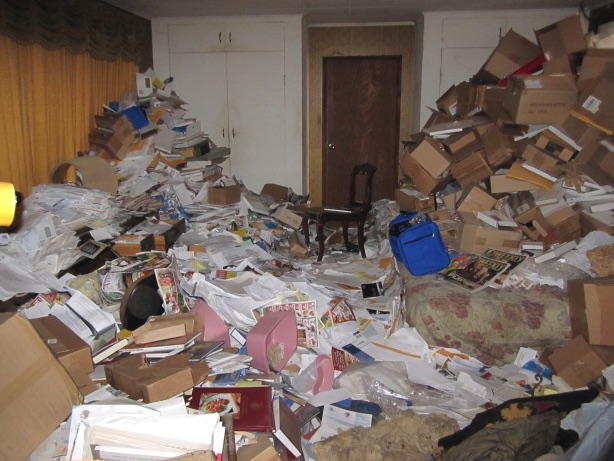 Paper-heavy Oak Park home before hoarding cleanup sorting